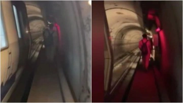 İstanbul'da metro hattındaki arıza nedeniyle yolcular raylarda y&uuml;r&uuml;d&uuml;